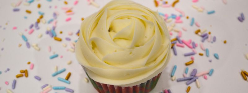 White Rosette on Rainbow Cupcake